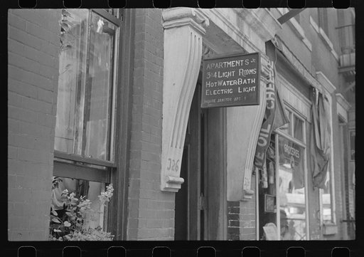 New York, New York. 61st Street between 1st and 3rd Avenues. A sign offering apartments for rent