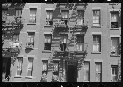 New York, New York. 61st Street between 1st and 3rd Avenues. House fronts