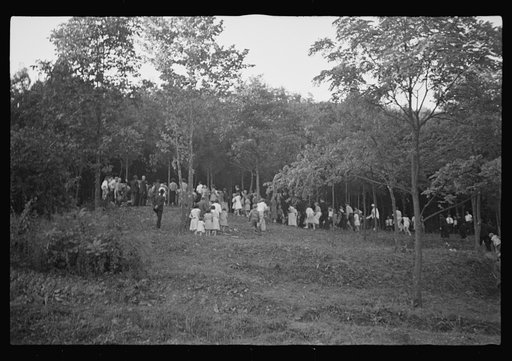 Untitled photo, possibly related to: Funeral procession of first death on project. Boy five years old. Red House Farms, West Virginia