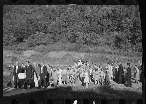 Untitled photo, possibly related to: Funeral procession of first death on project. Boy five years old. Red House Farms, West Virginia