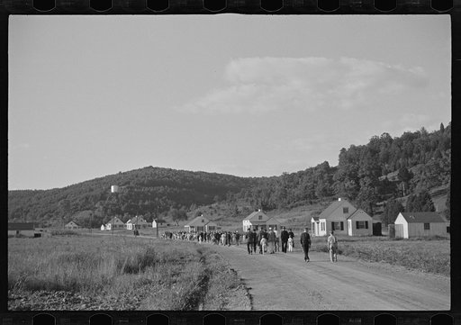 Untitled photo, possibly related to: Funeral procession of first death on project. Boy five years old. Red House Farms, West Virginia