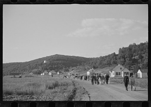 Untitled photo, possibly related to: Funeral procession of first death on project. Boy five years old. Red House Farms, West Virginia