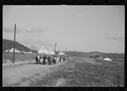 Untitled photo, possibly related to: Funeral procession of first death on project. Boy five years old. Red House Farms, West Virginia