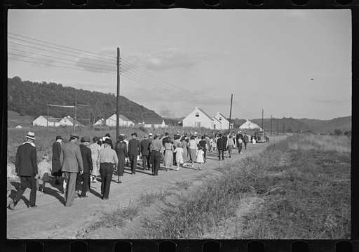 Untitled photo, possibly related to: Funeral procession of first death on project. Boy five years old. Red House Farms, West Virginia