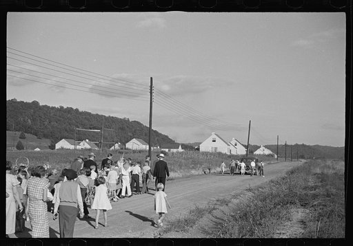 Untitled photo, possibly related to: Funeral procession of first death on project. Boy five years old. Red House Farms, West Virginia
