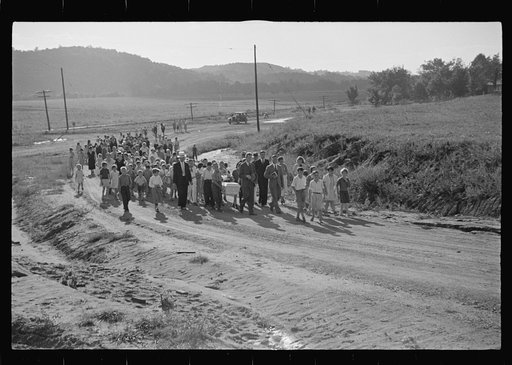 Funeral procession of first death on project. Boy five years old. Red House Farms, West Virginia