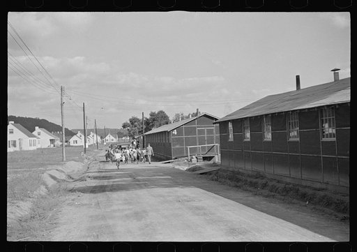 Untitled photo, possibly related to: Funeral procession of first death on project. Boy five years old. Red House Farms, West Virginia