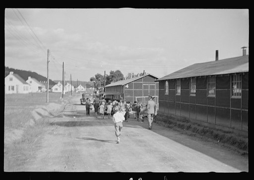 Untitled photo, possibly related to: Funeral procession of first death on project. Boy five years old. Red House Farms, West Virginia