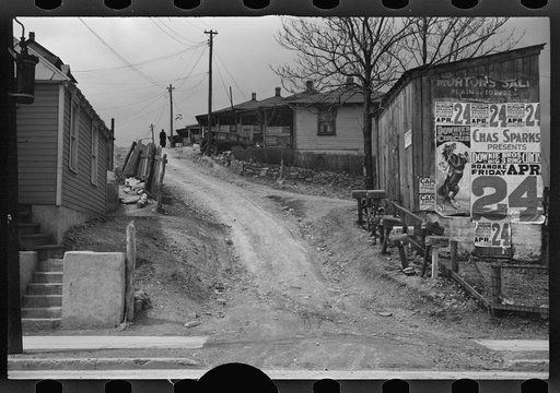 Untitled photo, possibly related to: [Posters covering a building near Lynchburg to advertise a Downie Bros. circus