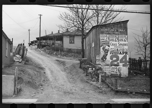 Untitled photo, possibly related to: [Posters covering a building near Lynchburg to advertise a Downie Bros. circus