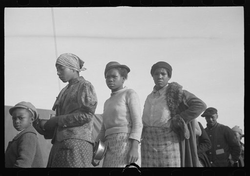 Untitled photo, possibly related to: Negroes in the lineup for food at meal time in the camp for flood refugees, Forrest City, Arkansas