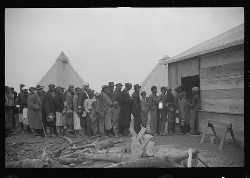 Untitled photo, possibly related to: Negroes in the lineup for food at meal time in the camp for flood refugees, Forrest City, Arkansas