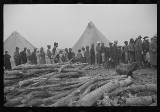 Untitled photo, possibly related to: Negroes in the lineup for food at meal time in the camp for flood refugees, Forrest City, Arkansas