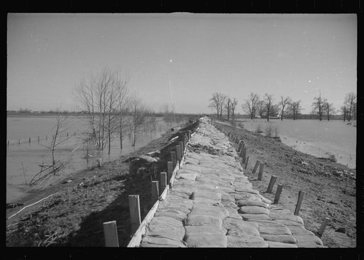 Untitled photo, possibly related to: The Bessie Levee augmented with sand bags during the 1937 flood near Tiptonville, Tennessee