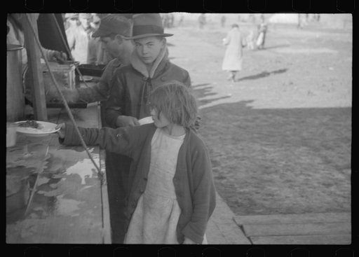 Untitled photo, possibly related to: Negroes in the lineup for food at mealtime in the camp for flood refugees, Forrest City, Arkansas