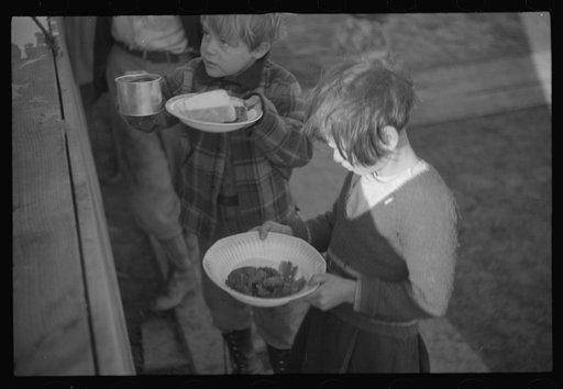 Untitled photo, possibly related to: Negroes in the lineup for food at mealtime in the camp for flood refugees, Forrest City, Arkansas