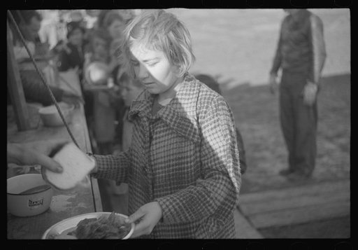 Untitled photo, possibly related to: Negroes in the lineup for food at mealtime in the camp for flood refugees, Forrest City, Arkansas