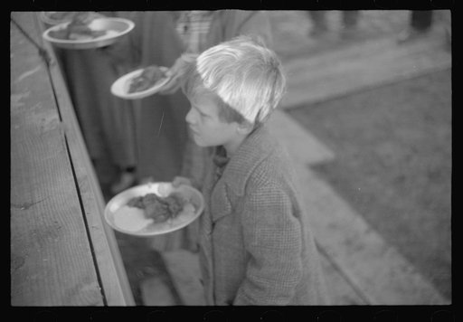 Untitled photo, possibly related to: Negroes in the lineup for food at mealtime in the camp for flood refugees, Forrest City, Arkansas