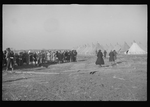 Untitled photo, possibly related to: Negroes in the lineup for food at mealtime in the camp for flood refugees, Forrest City, Arkansas