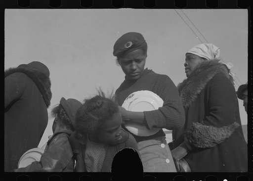 Untitled photo, possibly related to: Negroes in the lineup for food at mealtime in the camp for flood refugees, Forrest City, Arkansas