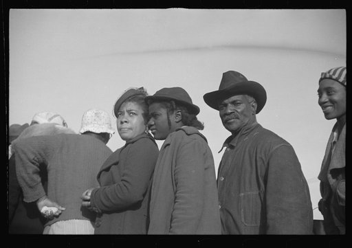 Untitled photo, possibly related to: Negroes in the lineup for food at mealtime in the camp for flood refugees, Forrest City, Arkansas
