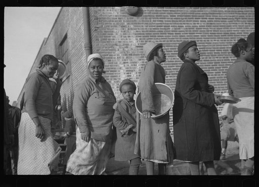Untitled photo, possibly related to: Negroes in the lineup for food at the flood refugee camp, Forrest City, Arkansas