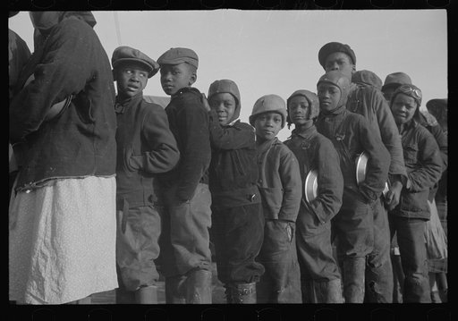 Untitled photo, possibly related to: Negroes in the lineup for food at the flood refugee camp, Forrest City, Arkansas