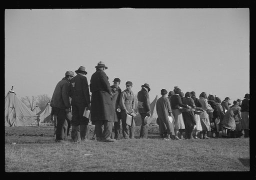 Untitled photo, possibly related to: Negroes in the lineup for food at the flood refugee camp, Forrest City, Arkansas