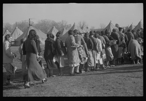 Refugees lined up at meal time in the camp for white flood refugees in Forest City, Arkansas