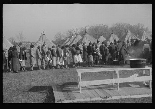 Untitled photo, possibly related to: Refugees lined up at meal time in the camp for white flood refugees in Forest City, Arkansas