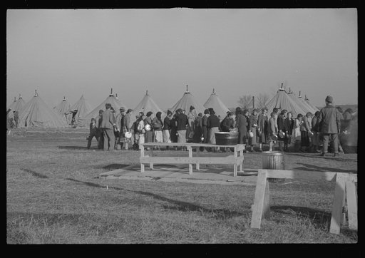 Untitled photo, possibly related to: Refugees lined up at meal time in the camp for white flood refugees in Forest City, Arkansas