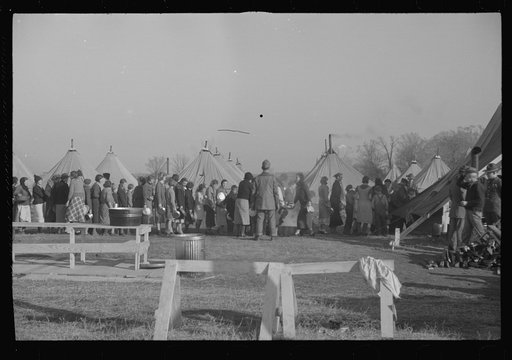 Untitled photo, possibly related to: Refugees lined up at meal time in the camp for white flood refugees in Forest City, Arkansas