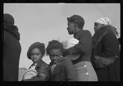 Untitled photo, possibly related to: Negroes in the lineup for food at meal time at the camp for flood refugees, Forrest City, Arkansas