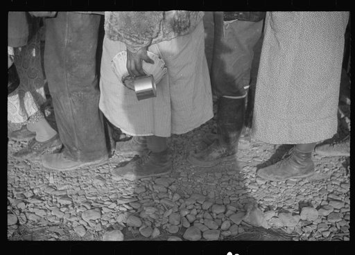 Untitled photo, possibly related to: Negroes at mealtime in the flood refugee camp, Forrest City, Arkansas