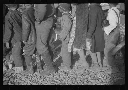 Untitled photo, possibly related to: Negroes at mealtime in the flood refugee camp, Forrest City, Arkansas