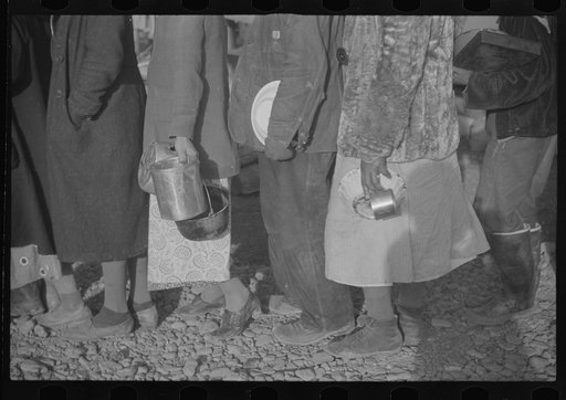 Untitled photo, possibly related to: Negroes at mealtime in the flood refugee camp, Forrest City, Arkansas