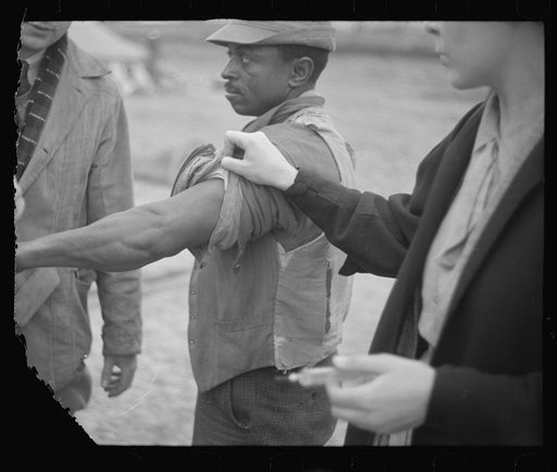 Untitled photo, possibly related to: Vaccination in the camp for Negro flood refugees at Marianna, Arkansas