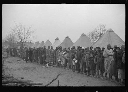 Untitled photo, possibly related to: Negroes in the lineup for food at mealtime in the camp for flood refugees, Forrest City, Arkansas