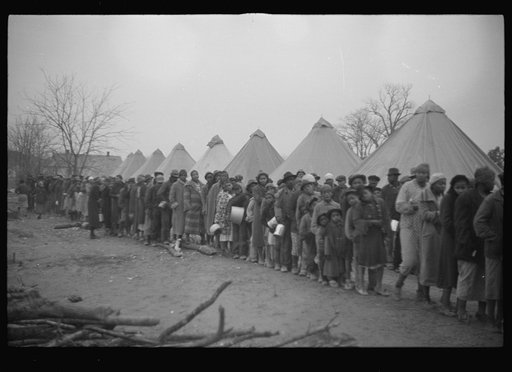 Untitled photo, possibly related to: Negroes in the lineup for food at mealtime in the camp for flood refugees, Forrest City, Arkansas