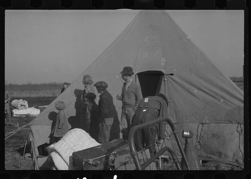Untitled photo, possibly related to: Setting up a tent in the camp for white flood refugees, Forrest City, Arkansas