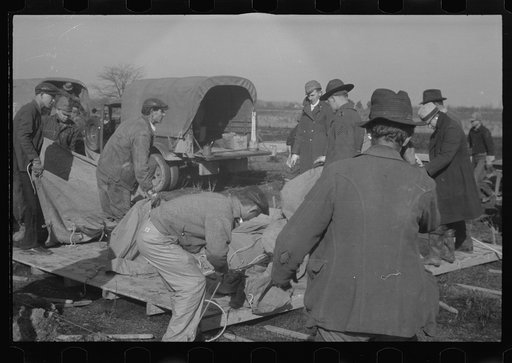 Setting up a tent in the camp for white flood refugees, Forrest City, Arkansas