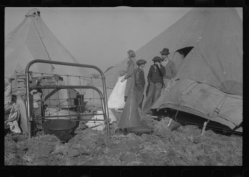 Untitled photo, possibly related to: Setting up a tent in the camp for white flood refugees, Forrest City, Arkansas