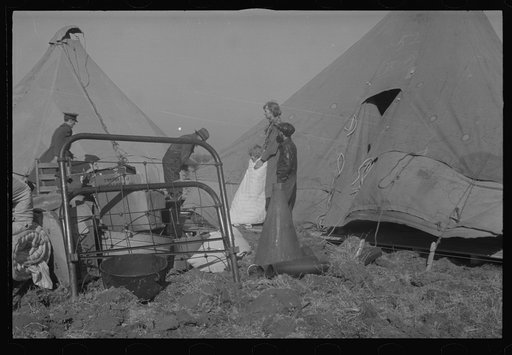 Untitled photo, possibly related to: Setting up a tent in the camp for white flood refugees, Forrest City, Arkansas