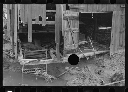 Untitled photo, possibly related to: Barn and farm equipment ruined by flood waters. Hatfield, Massachusetts