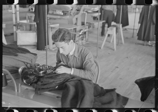 Untitled photo, possibly related to: Interior of cooperative garment factory at Jersey Homesteads, showing some of eighty homesteaders at their work and some of the ladies' coats made by them. Hightstown, New Jersey