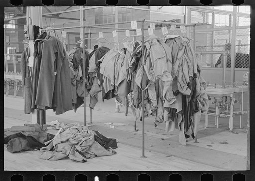 Untitled photo, possibly related to: Half-made garments on the racks, awaiting final operations of the machines, in cooperative garment factory, Hightstown, New Jersey