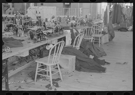 Untitled photo, possibly related to: Half-made garments on the racks, awaiting final operations of the machines, in cooperative garment factory, Hightstown, New Jersey