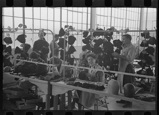 Untitled photo, possibly related to: Steam pressing the cloth is one process in manufacturing women's coats at Jersey Homesteads, Hightstown