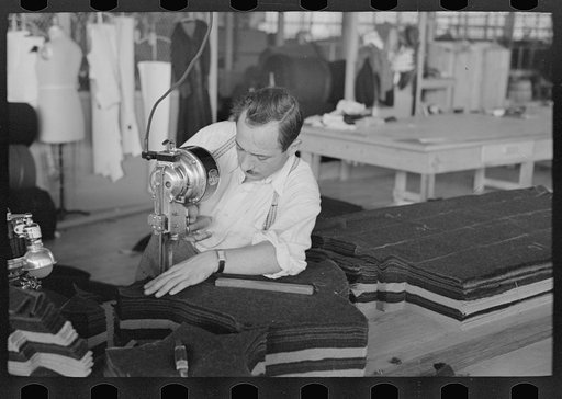 Untitled photo, possibly related to: Philip Goldstein assistant cutter in the cooperative garment factory at Jersey Homesteads. He is secretary of the Colonists' Association, Inc., Hightstown, New Jersey