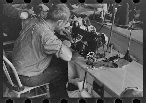 Closeup of cloak operator in cooperative garment factory at Jersey Homesteads, Hightstown, New Jersey